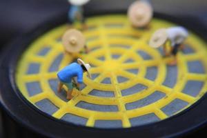 photo of a miniature figure with the concept of a farmer farming on a respirator.