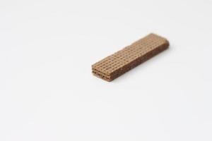 a close up of chocolate wafers isolated on white background. photo