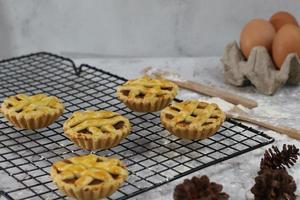 Small apple pie served on a cake rack, tastes sweet and savory. Food concept photo. photo