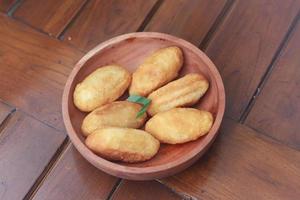 Comro or combro, a traditional Javanese snack made of deep fried grated cassava filled with a savory mix of oncom or fermented soy bean cake and chili photo