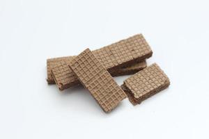 a close up of chocolate wafers isolated on white background. photo