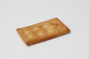 a close up of coconut biscuit with sprinkled sugar isolated on white background. photo