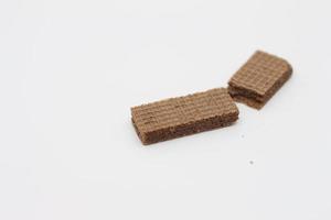 a close up of chocolate wafers isolated on white background. photo