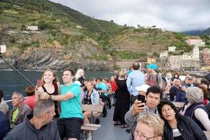 VERNAZZA, ITALY - SEPTEMBER 23 2017 - Tourist in  Cinque Terre on rainy day photo