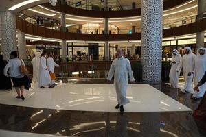 DUBAI, UAE - AUGUST, 14 2017 - People buying at Dubai Mall photo