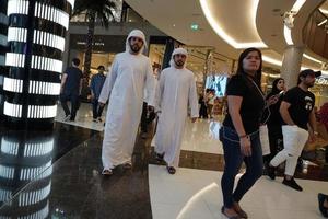 DUBAI, UAE - AUGUST, 14 2017 - People buying at Dubai Mall photo