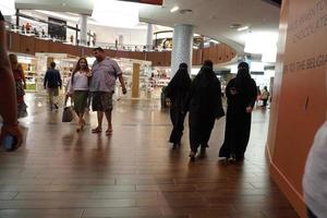 DUBAI, UAE - AUGUST, 14 2017 - People buying at Dubai Mall photo