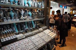 DUBAI, UAE - AUGUST, 14 2017 - People buying at Dubai Mall photo