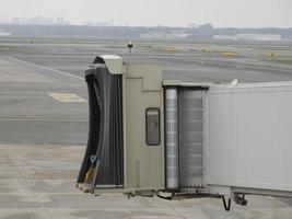 Access gangway to the aircraft tunnel from terminal to plane photo