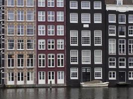 amsterdam old houses view from canals photo