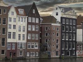 amsterdam old houses view from canals photo