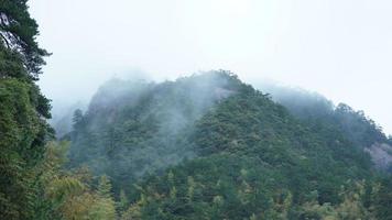 The beautiful mountains view with the fog during the rainy day photo