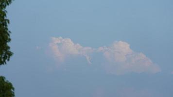 The summer sky view with the white clouds and blue sky as background photo