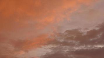 The beautiful sunset sky view with the colorful clouds and warm lights in the sky photo