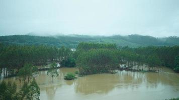 The beautiful countryside view from the runny train on the south of the China in the rainy day photo