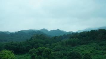 The beautiful countryside view from the runny train on the south of the China in the rainy day photo