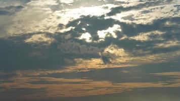 The beautiful sunset sky view with the colorful clouds and warm lights in the sky photo