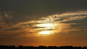 The beautiful sunset sky view with the colorful clouds and warm lights in the sky photo