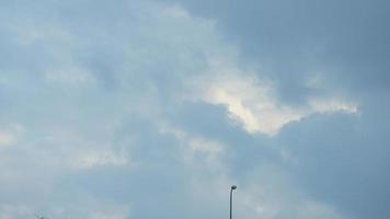 The summer sky view with the white clouds and blue sky as background photo