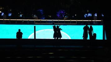 The silhouette view in the city square at night in summer photo