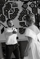 the first dance of the bride and groom inside a restaurant photo