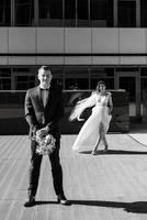 bride and groom first meeting on the roof of skyscraper photo