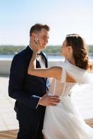 bride and groom first meeting on the roof of skyscraper photo