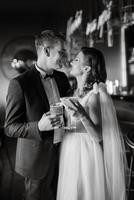 bride and groom inside a cocktail bar photo