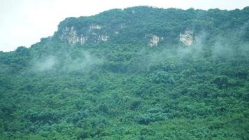The beautiful mountains view with the fog during the rainy day photo
