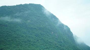 The beautiful mountains view with the fog during the rainy day photo