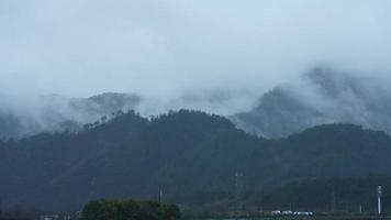 The beautiful mountains view with the fog during the rainy day photo