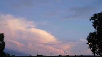 The beautiful sunset sky view with the colorful clouds and warm lights in the sky photo