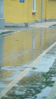 The rainy day view in the city with the wet road and rainy droplets down photo