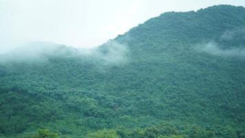The beautiful mountains view with the fog during the rainy day photo