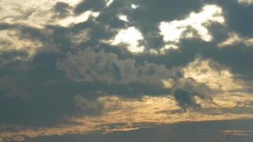 The beautiful sunset sky view with the colorful clouds and warm lights in the sky photo