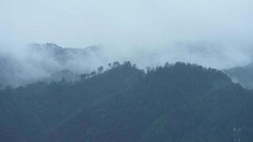 The beautiful mountains view with the fog during the rainy day photo