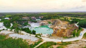 aerial photograph of a large pit of a gypsum mine. A large gypsum mine. Mining and Geology Industry Concepts photo