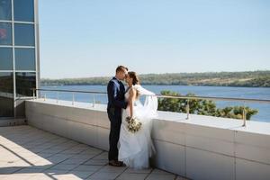 bride and groom first meeting on the roof of skyscraper photo