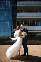 bride and groom first meeting on the roof of skyscraper photo