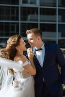 bride and groom first meeting on the roof of skyscraper photo