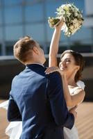 bride and groom first meeting on the roof of skyscraper photo