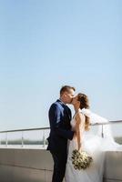 bride and groom first meeting on the roof of skyscraper photo