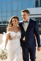 bride and groom first meeting on the roof of skyscraper photo