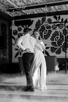 the first dance of the bride and groom inside a restaurant photo