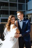 bride and groom first meeting on the roof of skyscraper photo