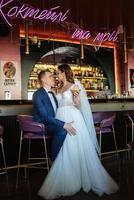 bride and groom inside a cocktail bar photo