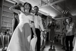 the first dance of the bride and groom inside a restaurant photo