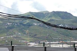 electric cables with mountain background photo