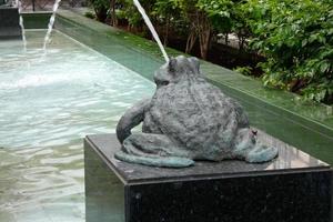 Urban ornamental water fountain in the city centre photo