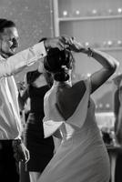 the first dance of the bride and groom inside a restaurant photo